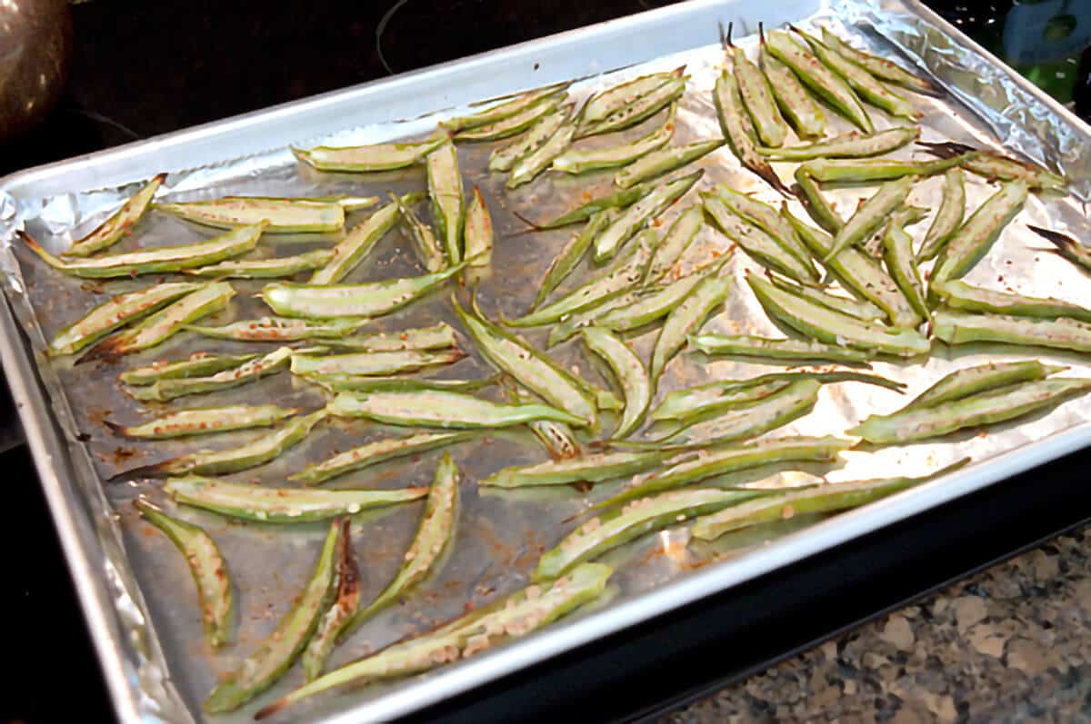 Sheet pan of okra after roasting for 20 minutes.