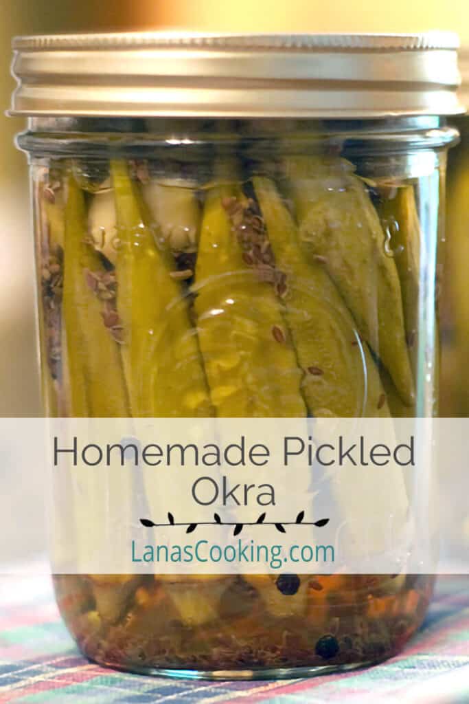 Canning jars filled with homemade pickled okra.