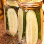 Glass jars of refrigerator dill pickles.