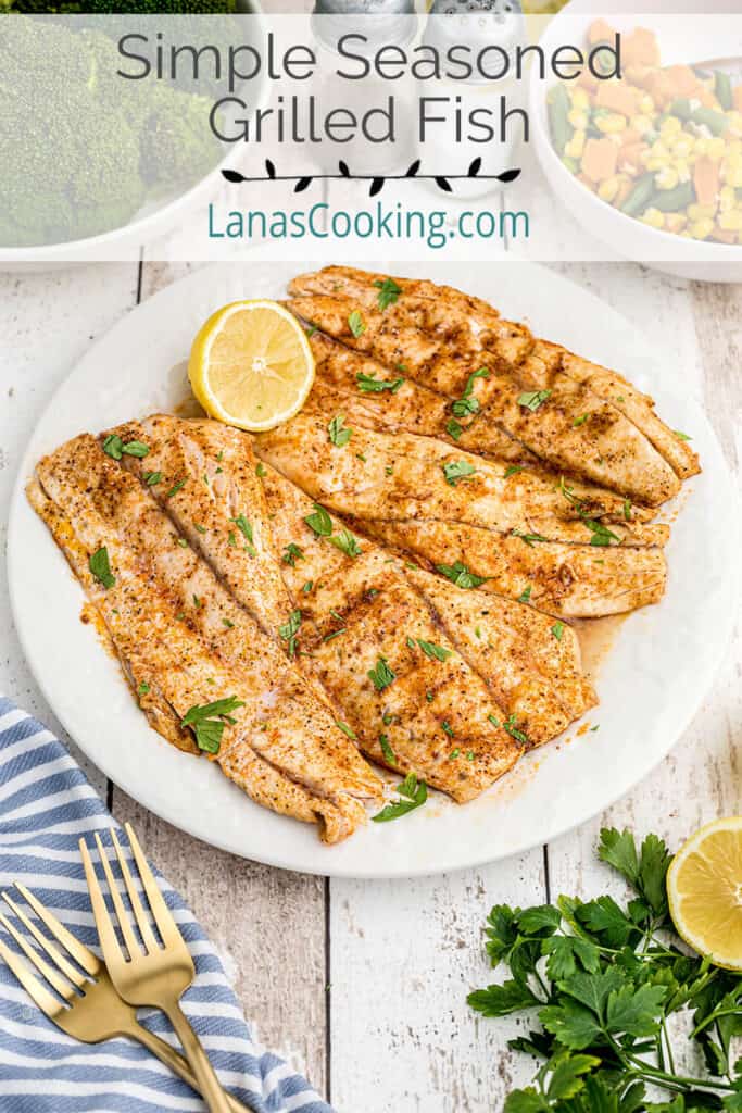 Grilled fish with lemon and parsley on a serving plate.