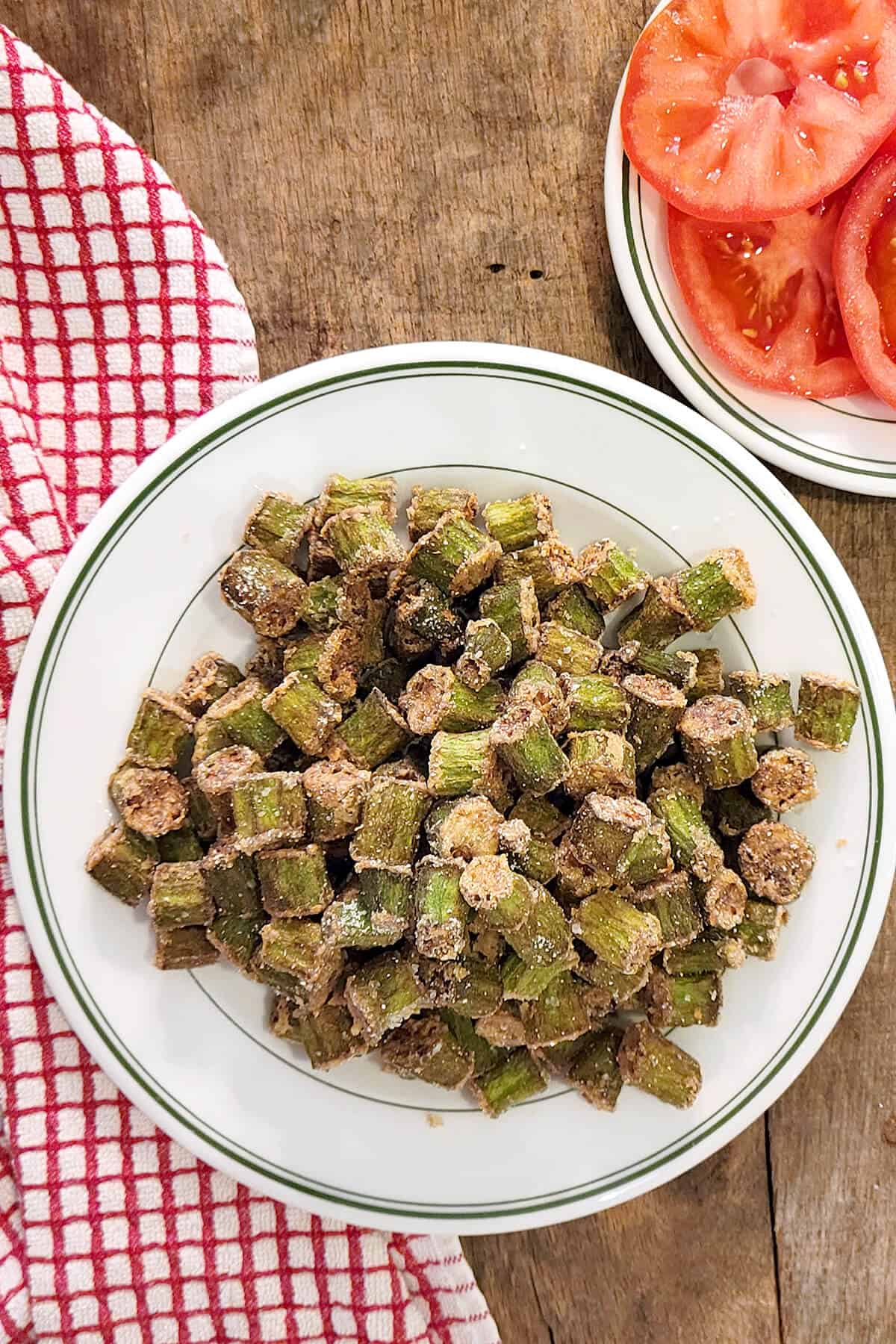 A plate heaped with golden brown fried okra.