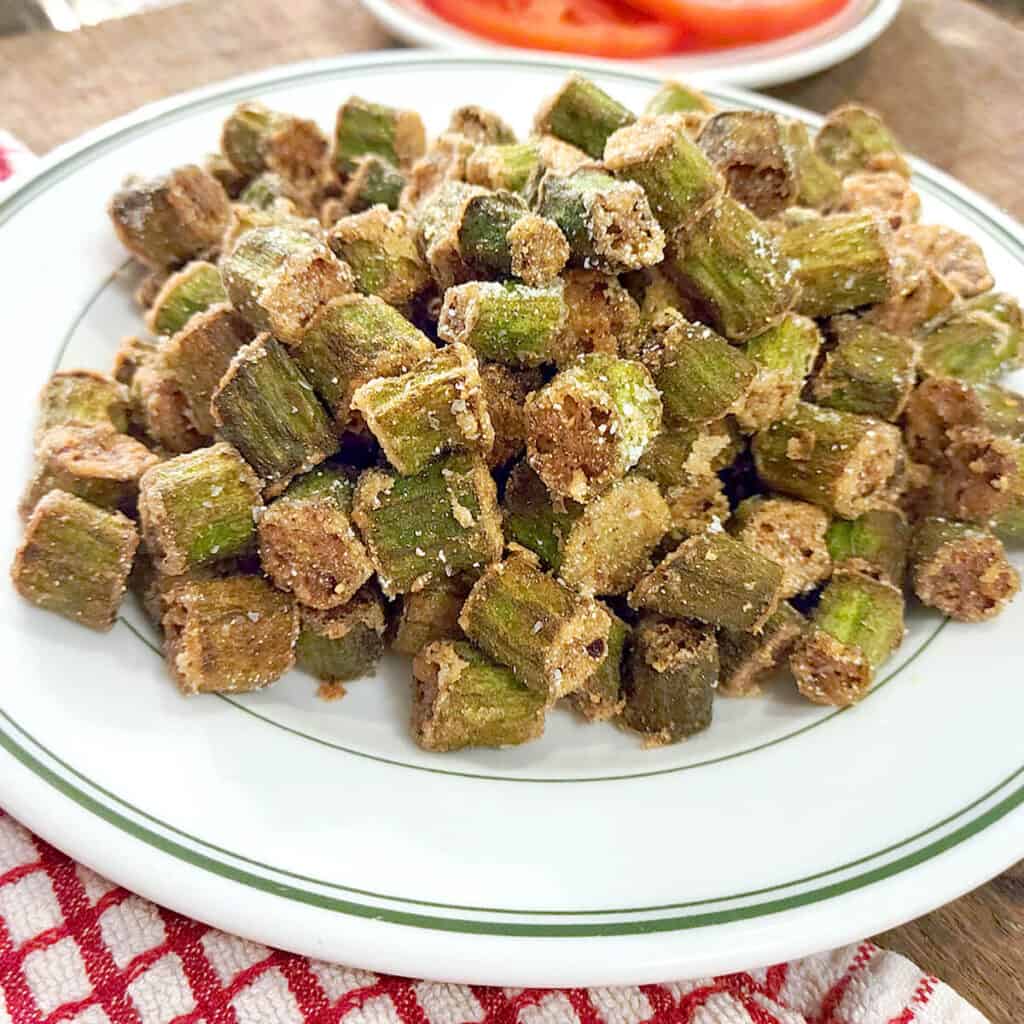A plate heaped with golden brown fried okra.