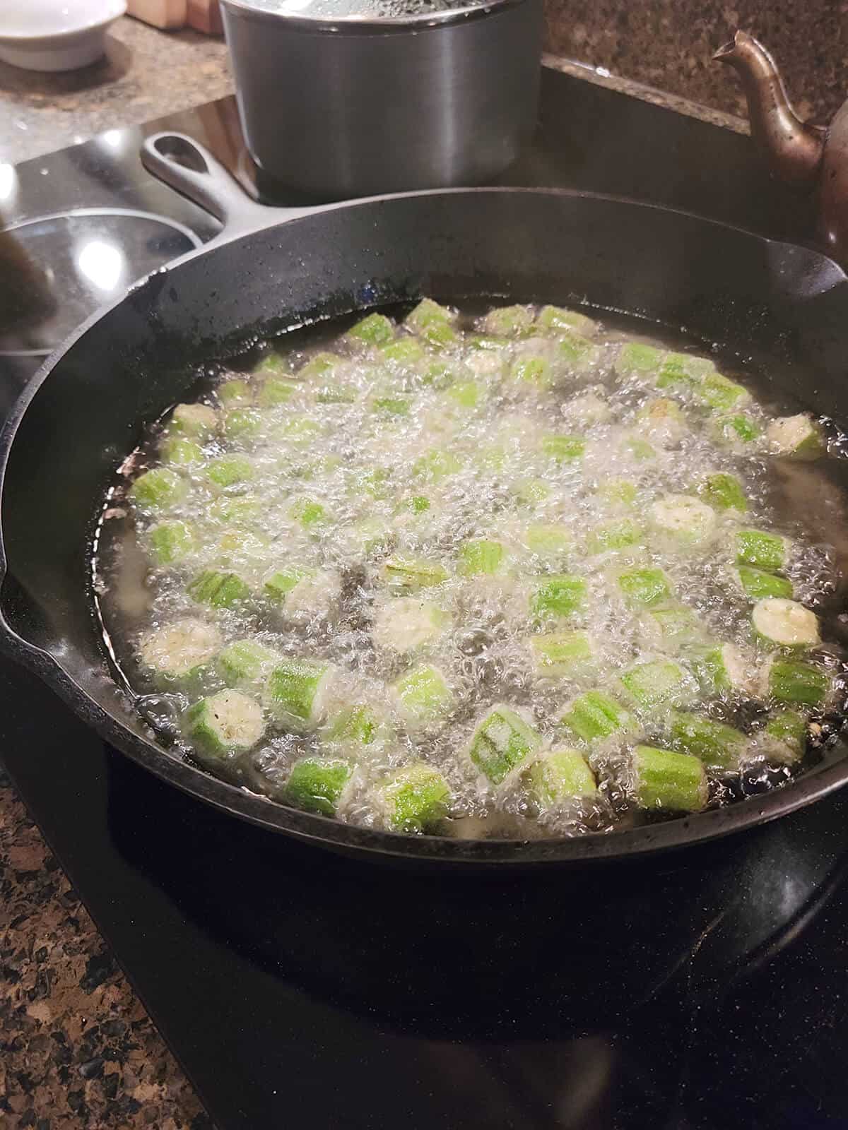 Okra about mid way through the frying process.