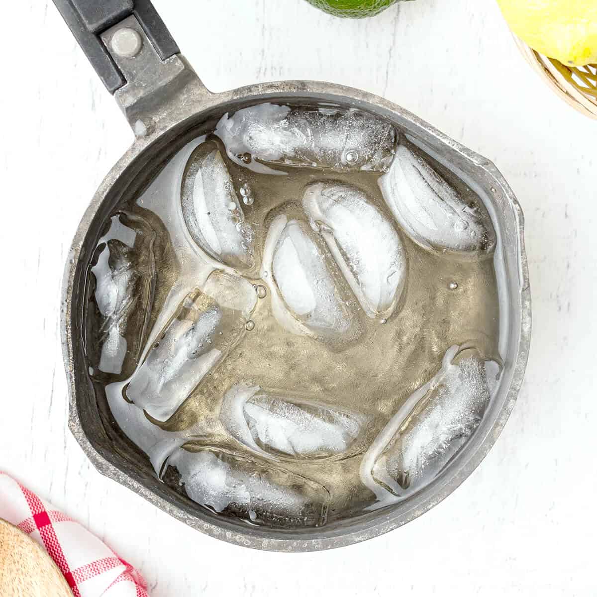 Ice added to boiled sugar and water.