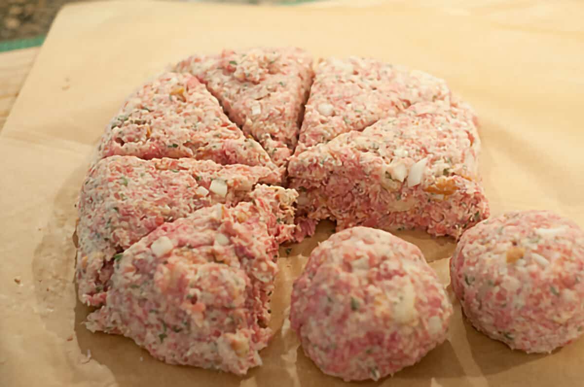 Showing how to divide the mixture evenly into eight meatballs.