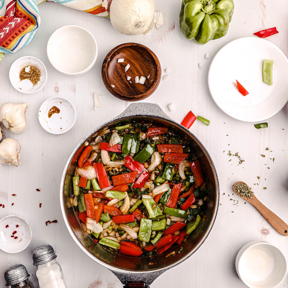 Vegetables sauteeing in a pan.