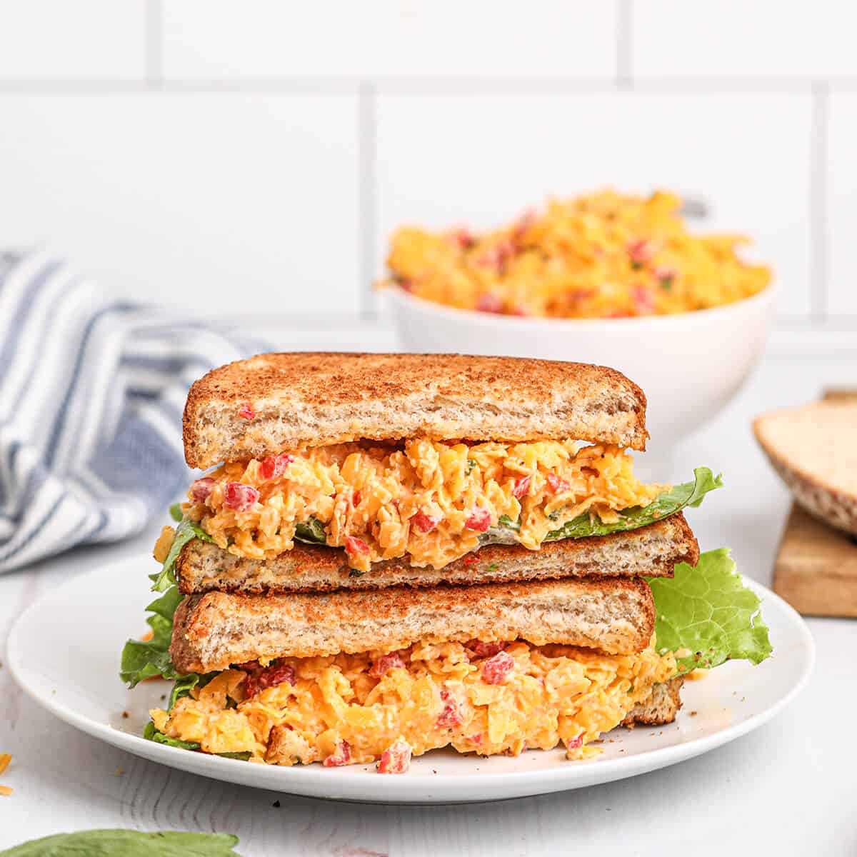 Pimiento Cheese sandwich on a white serving plate.
