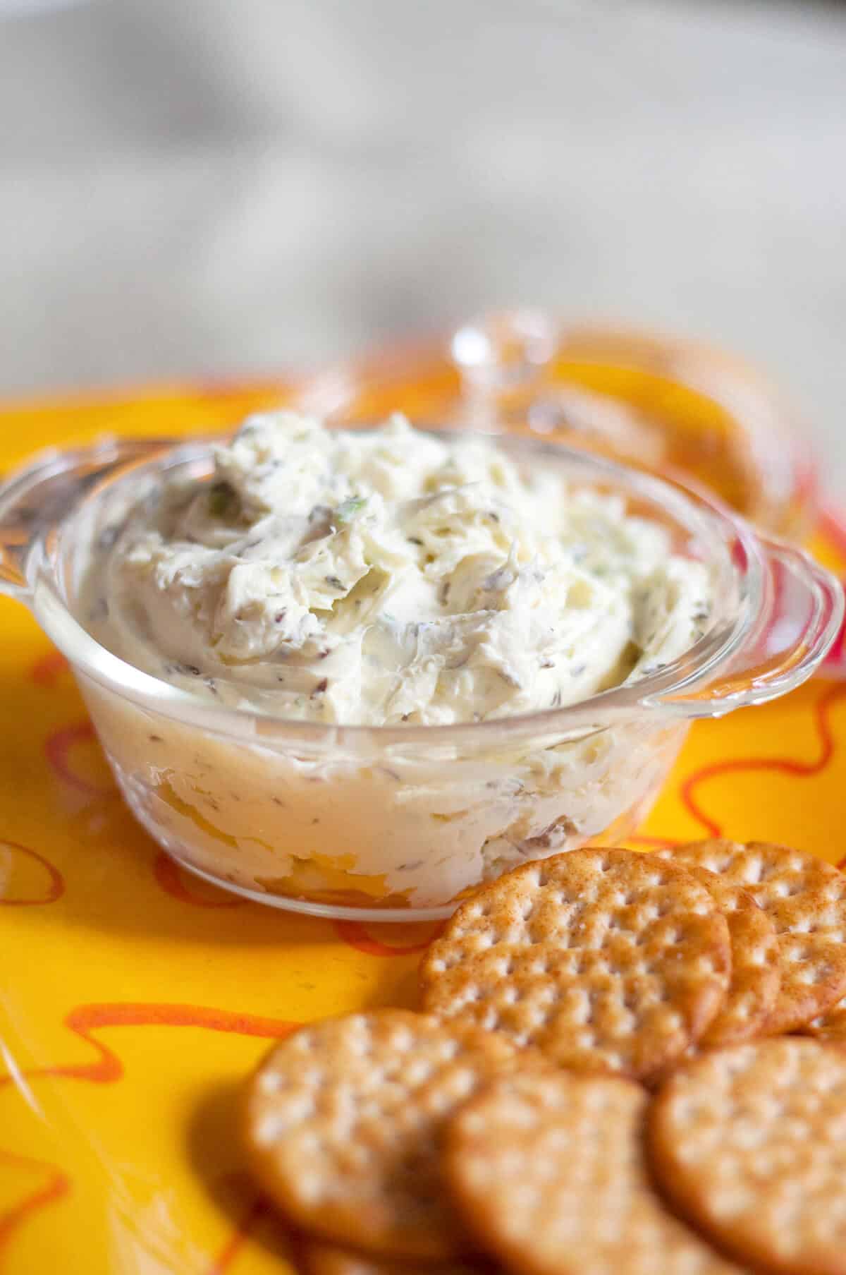 Caraway cheese spread in a glass bowl.