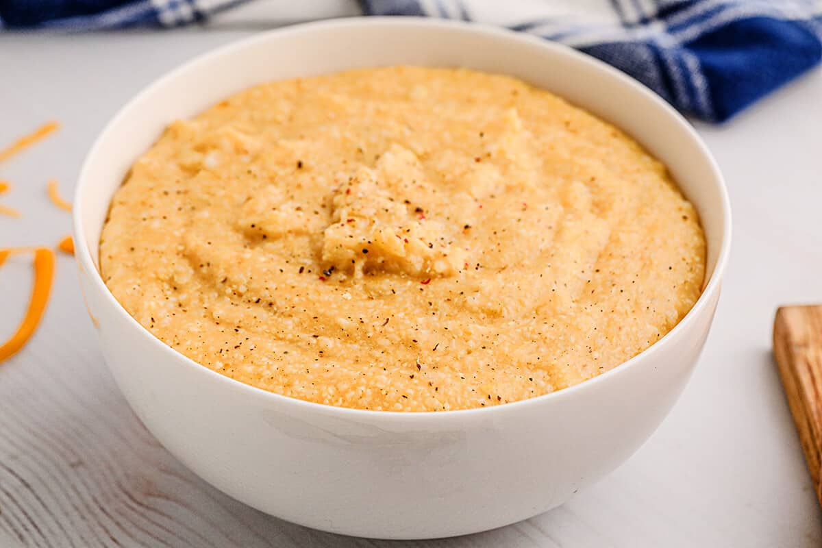 A white bowl filled with cheese grits.