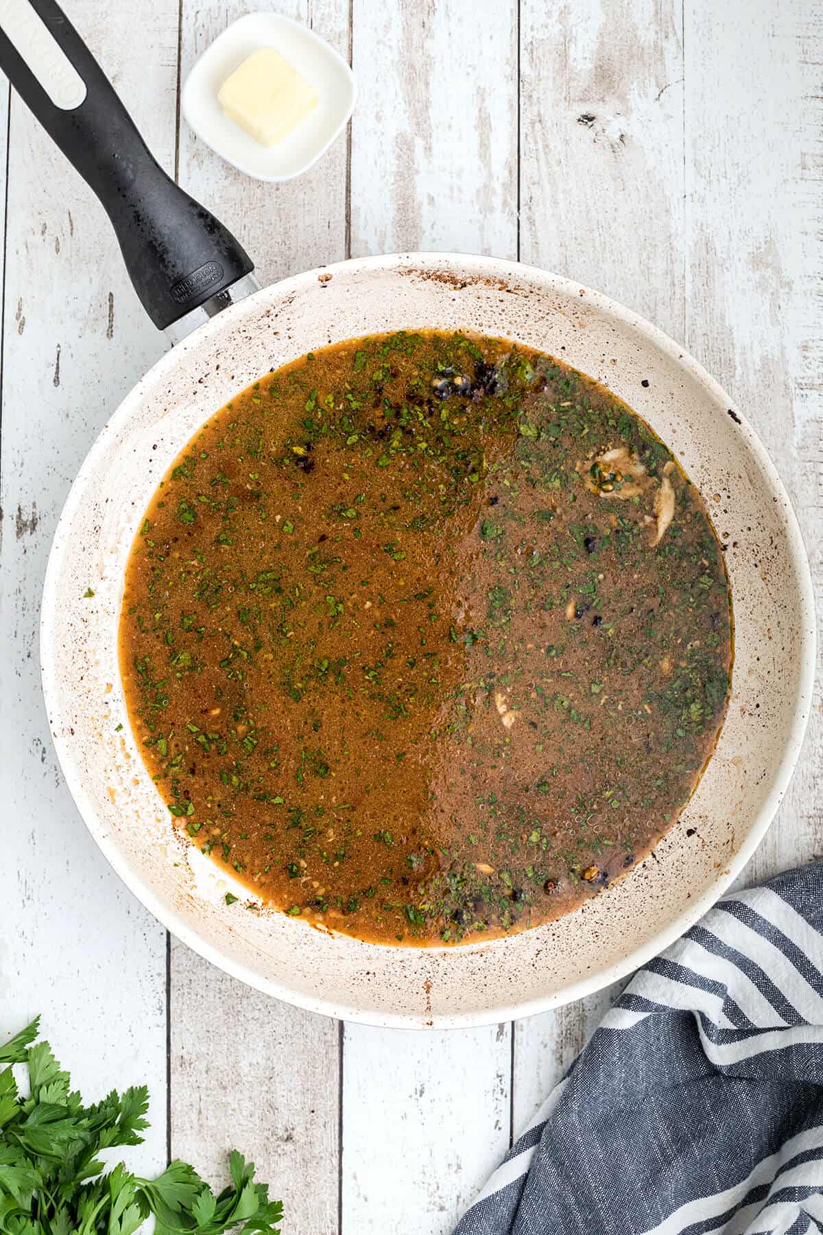 Reserved marinade in a skillet.