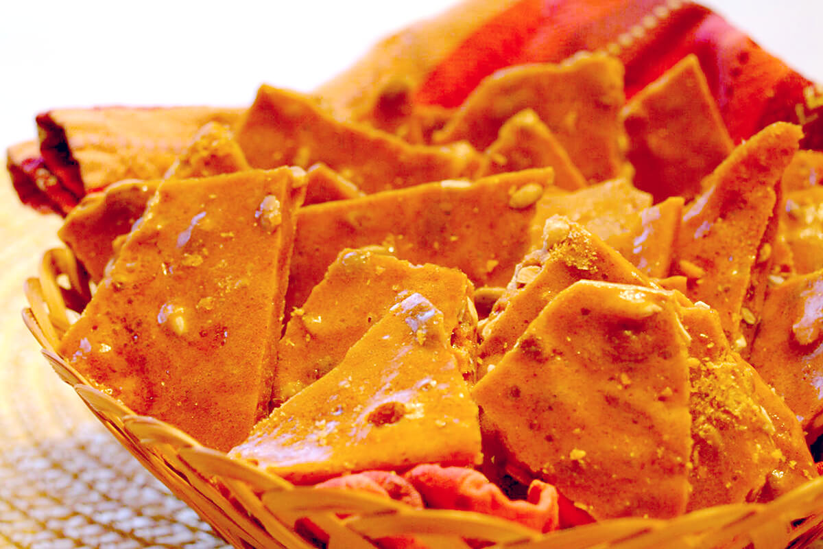 Cinnamon Pumpkin Seed Brittle in a basket.