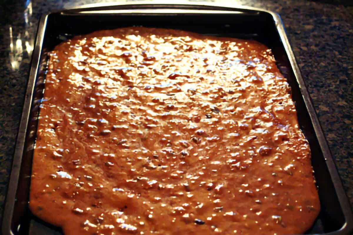 Hot brittle mixture poured into the prepared baking sheet.