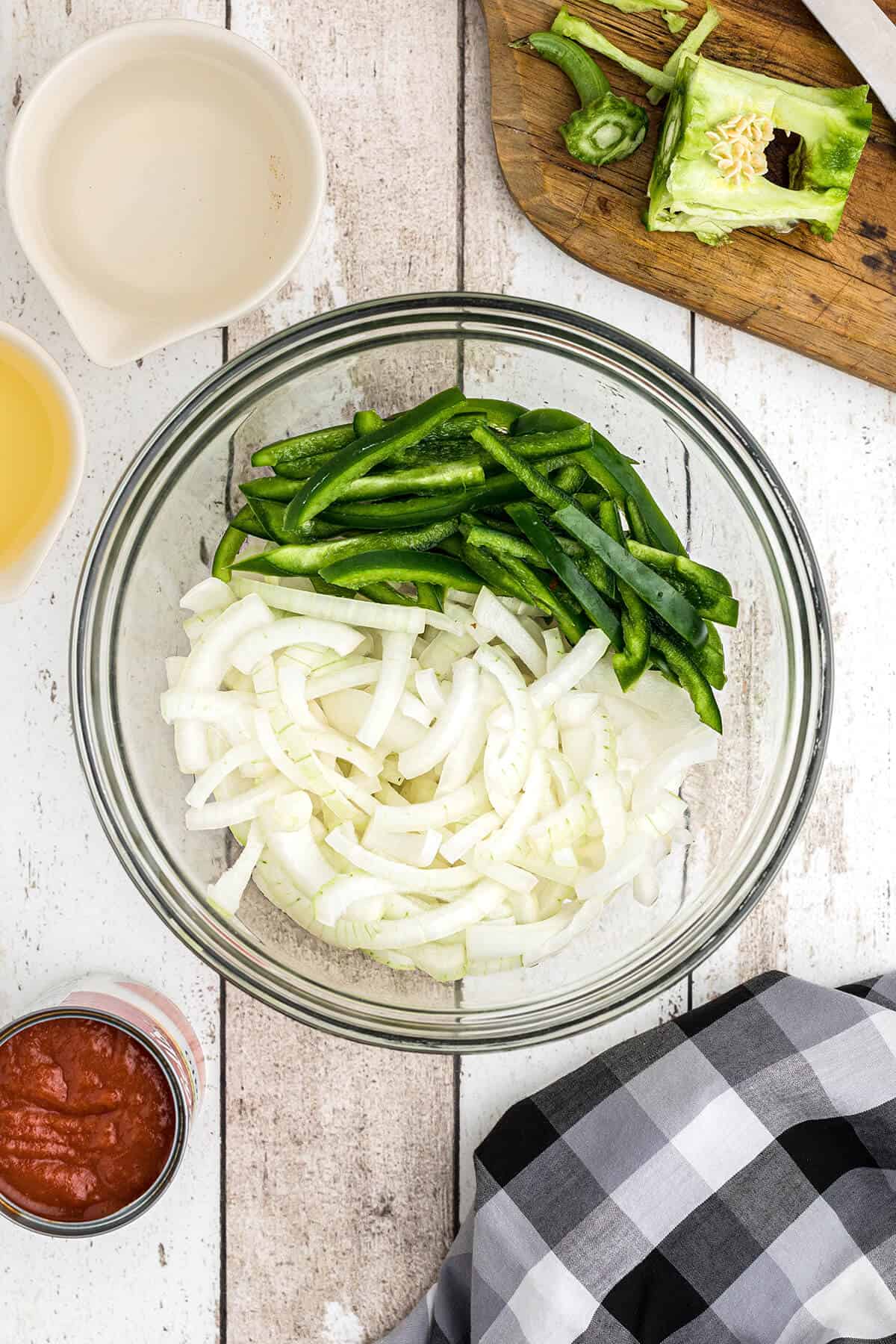 Prepping onions and peppers.