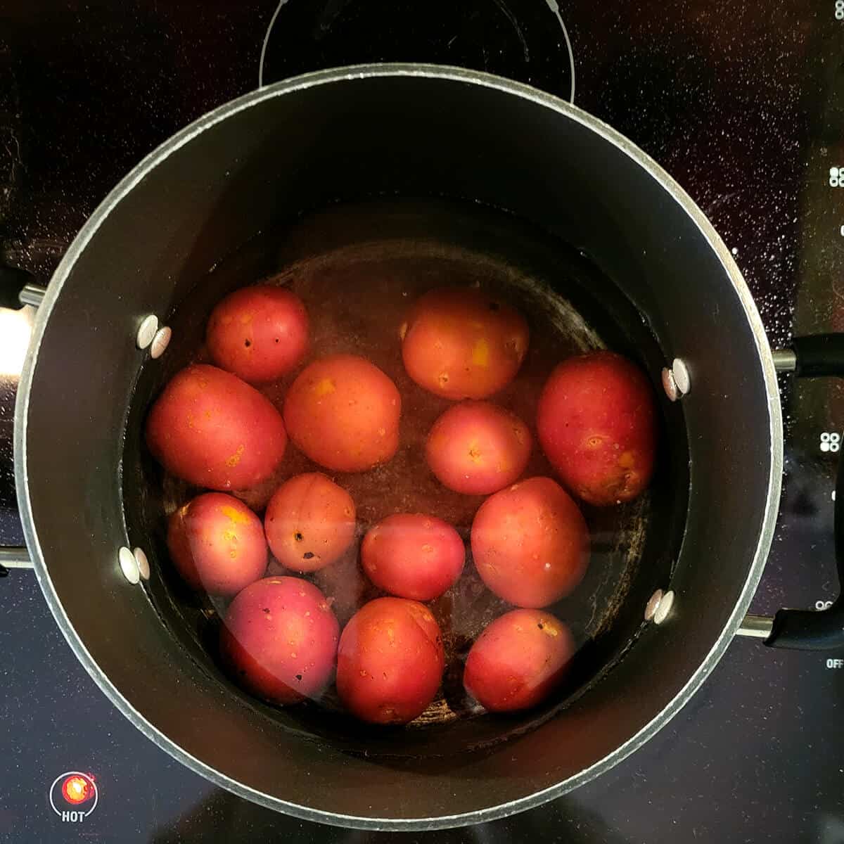 Potatoes and water in a pot.