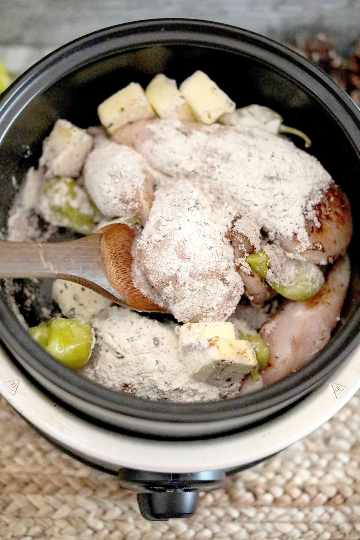 All remaining ingredients added on top of chicken breasts in a slow cooker.