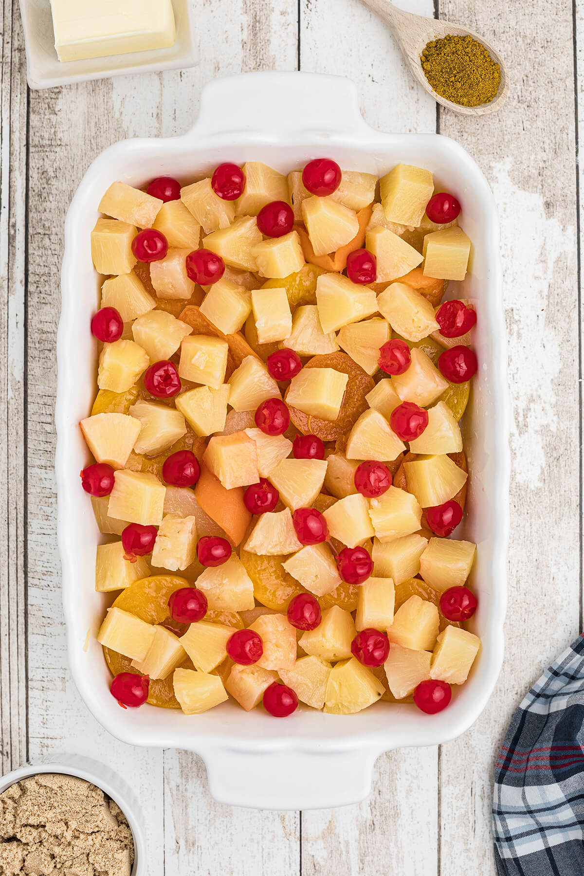 Drained fruit layered in a 9x13 baking dish.