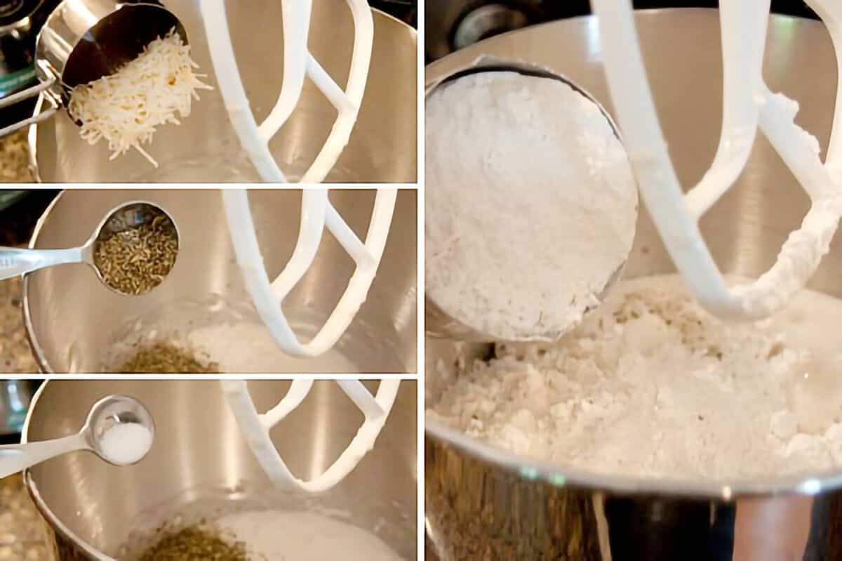 Adding ingredients to proofed yeast in a stand mixer bowl.