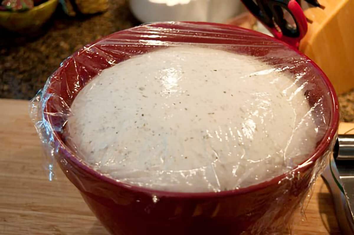 Dough in a mixing bowl after rising.