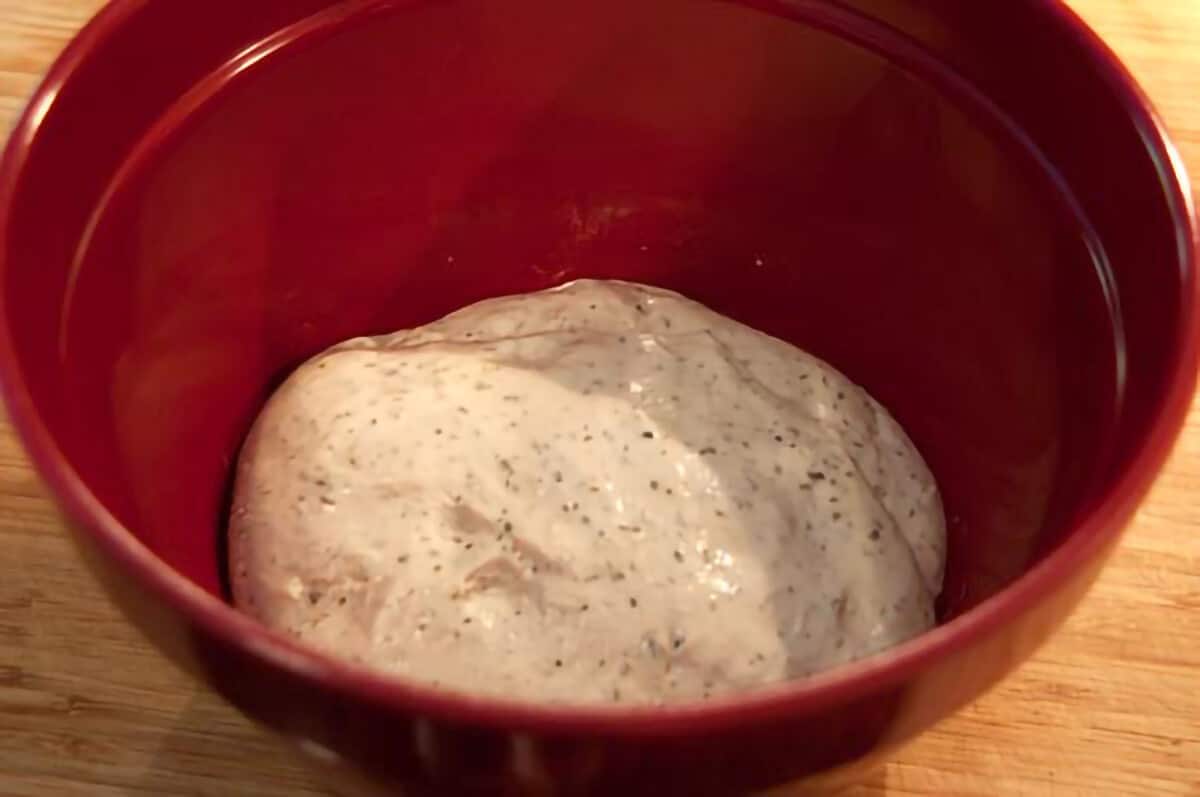 Dough in a mixing bowl before rising.