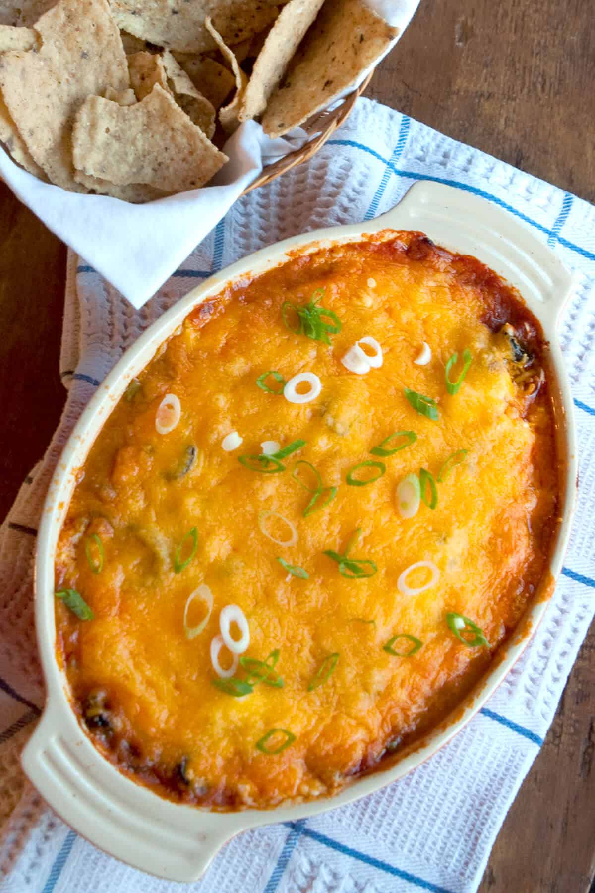 Finished refried bean dip in a baking dish.