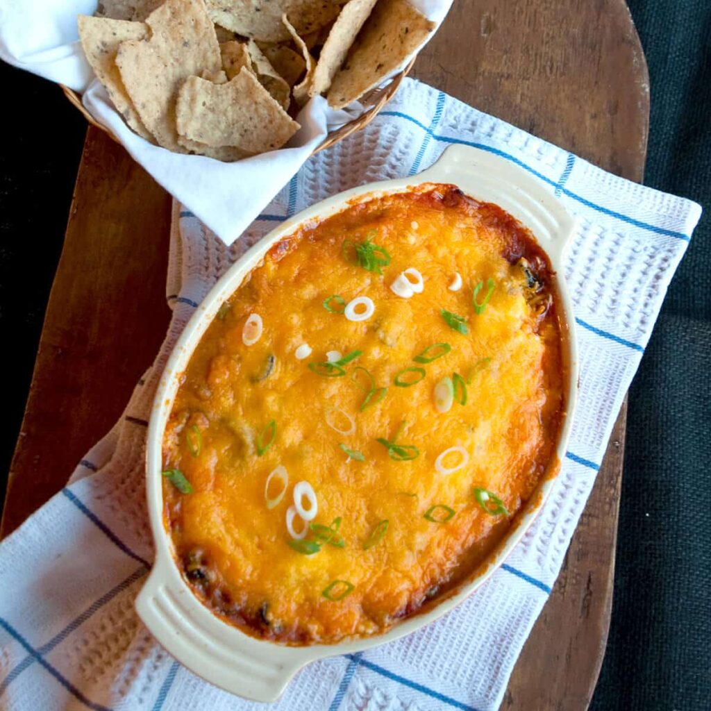Finished refried bean dip in a baking dish.