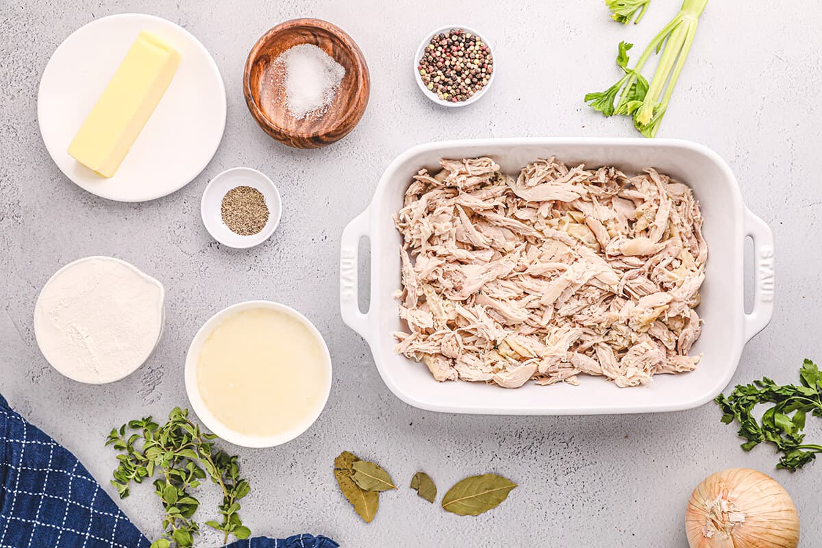 Shredded chicken in a baking dish.