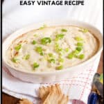 Crab dip in a baking dish with crackers on the side.