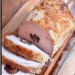 Apricot and Prune Stuffed Pork Loin on a wooden serving board.