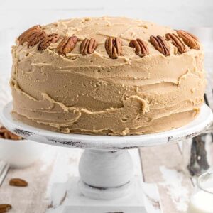 Southern caramel layer cake on a white cake stand.