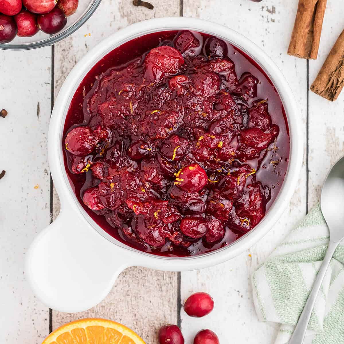 Cooled cranberry sauce in a white dish.
