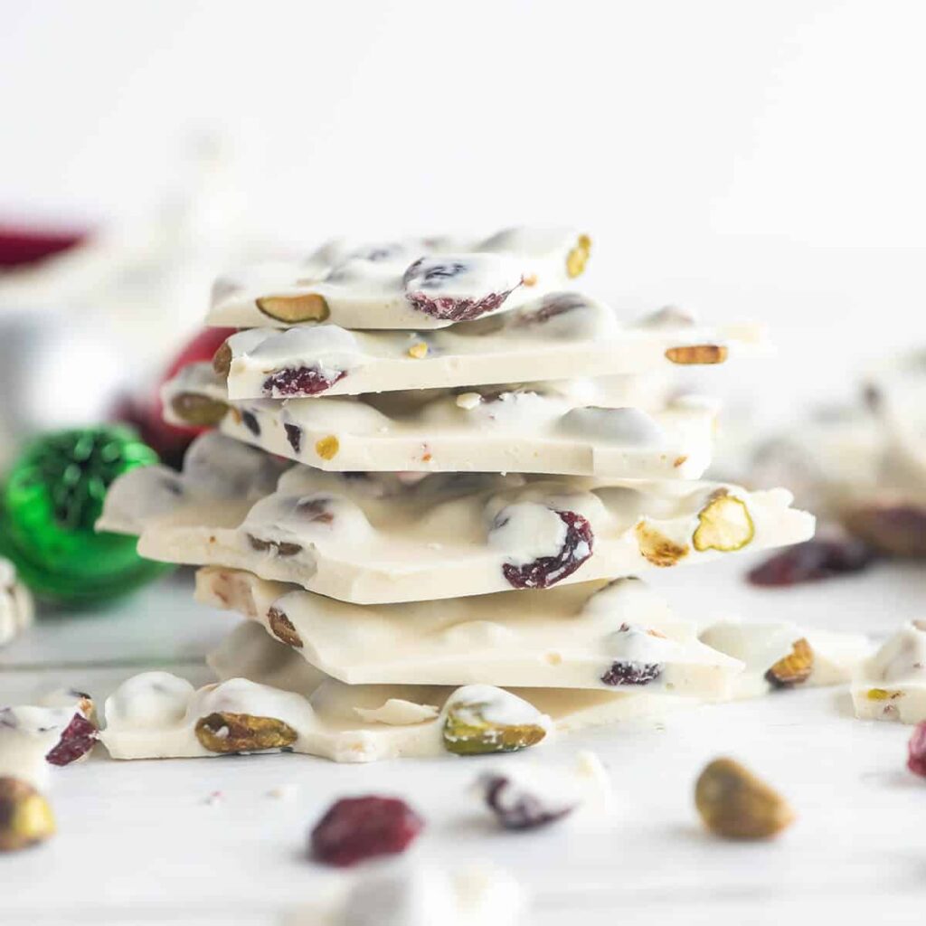 Finished white chocolate bark pieces stacked.