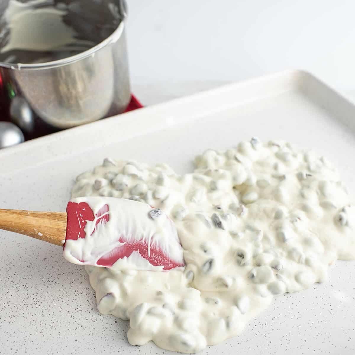 Candy mixture poured onto a baking sheet.