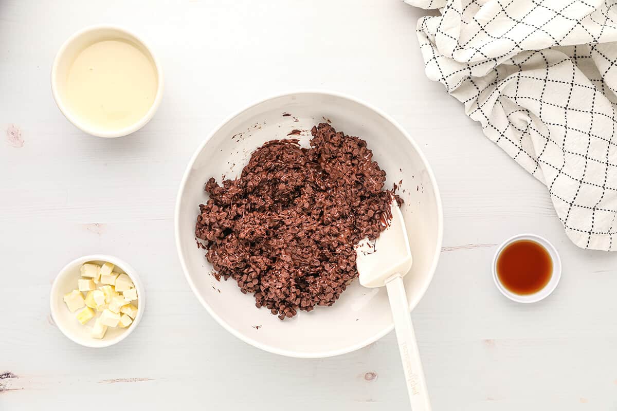 Partially melted chocolate chips in a bowl.