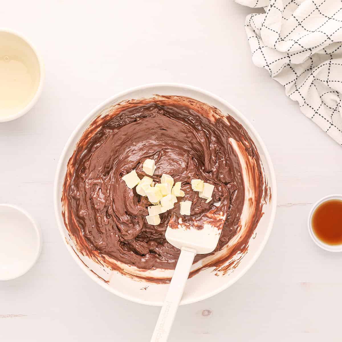 Small pieces of butter added to top of chocolate.