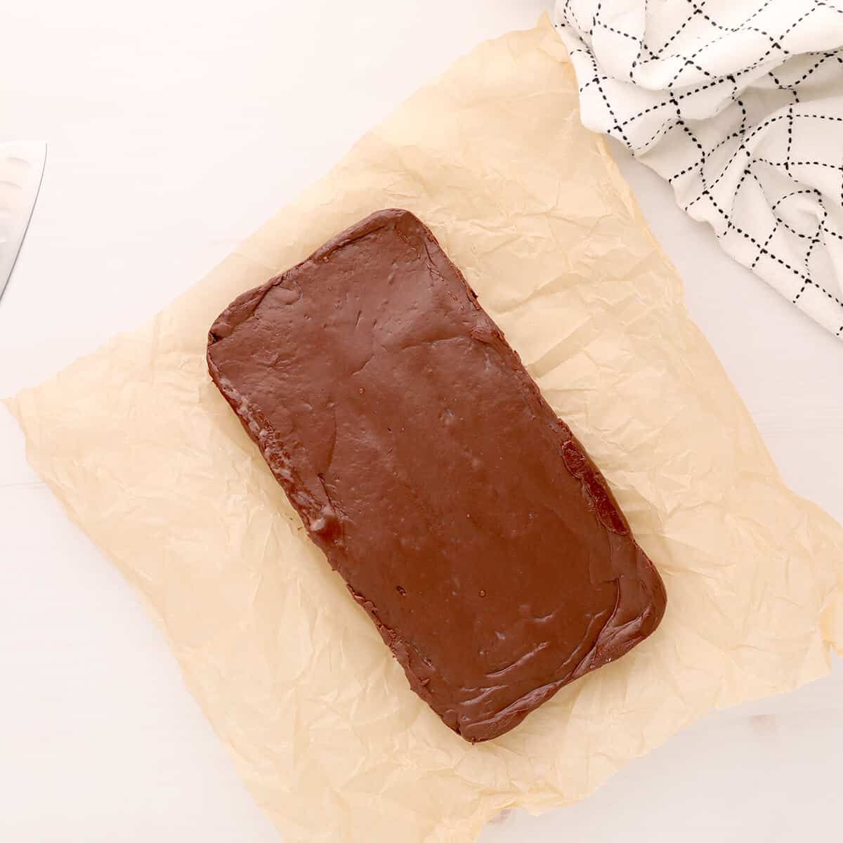 Fudge unmolded onto parchment paper.