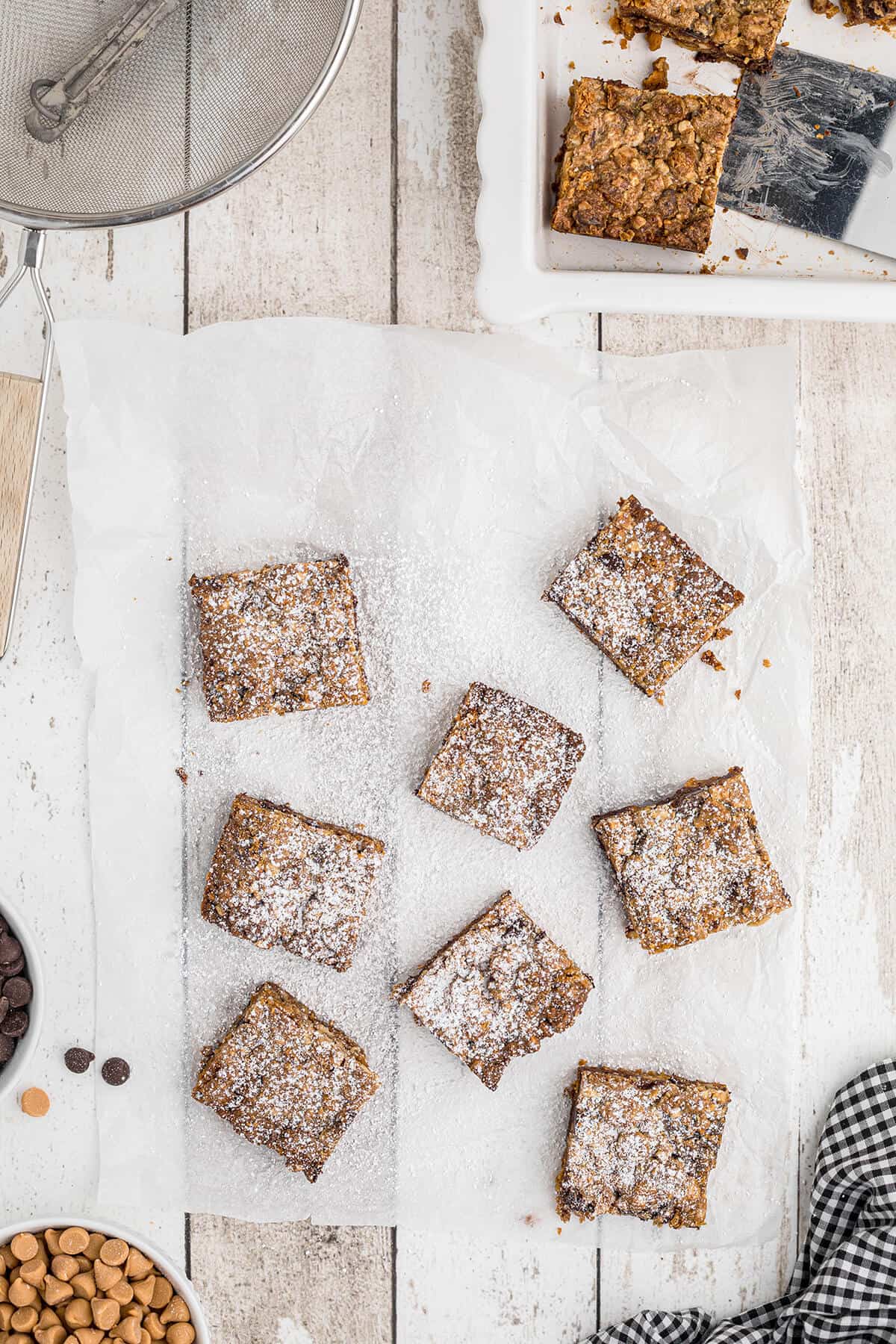 Cookies cut into squares and dusted with powdered sugar.