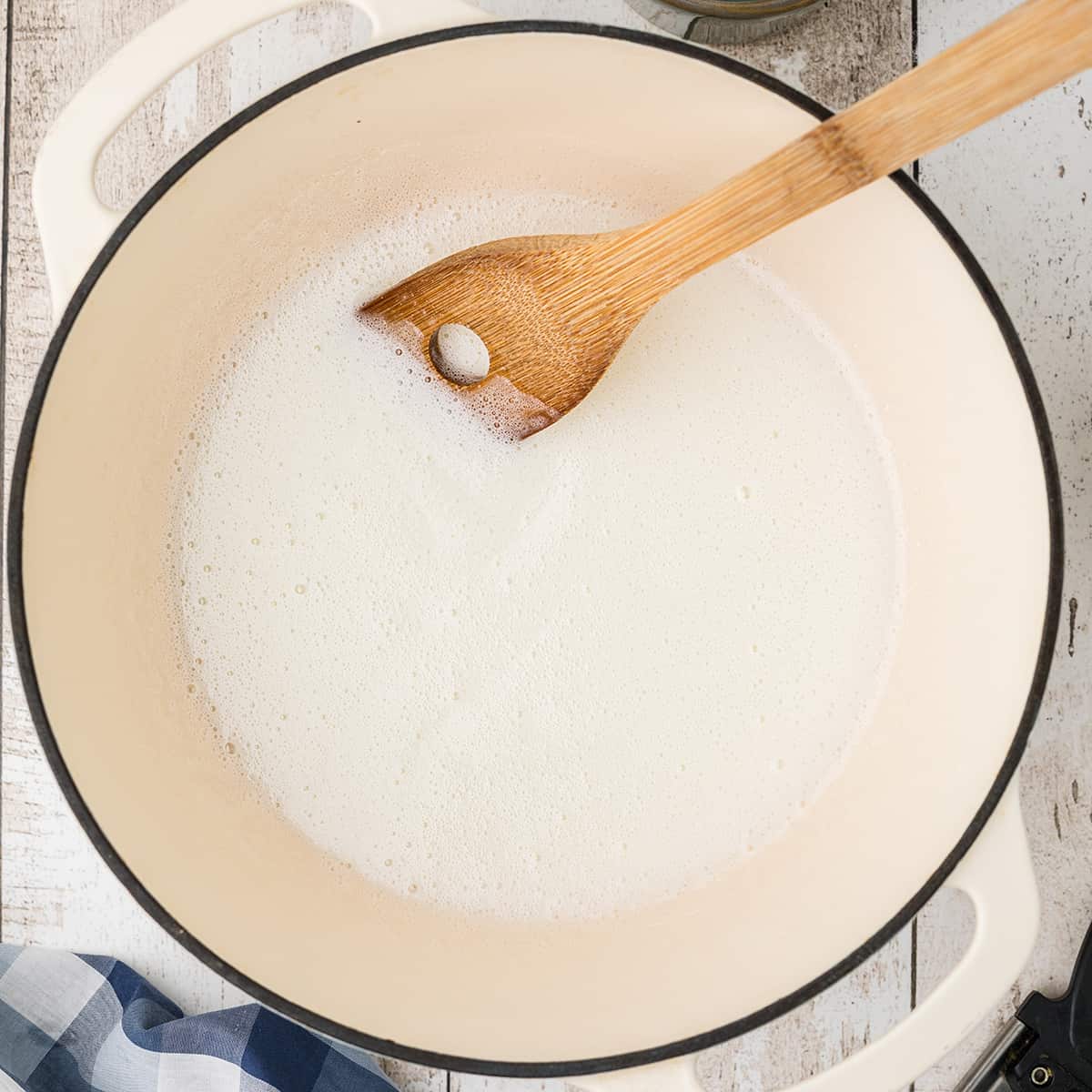 Cooking until sugar is dissolved in a saucepan.