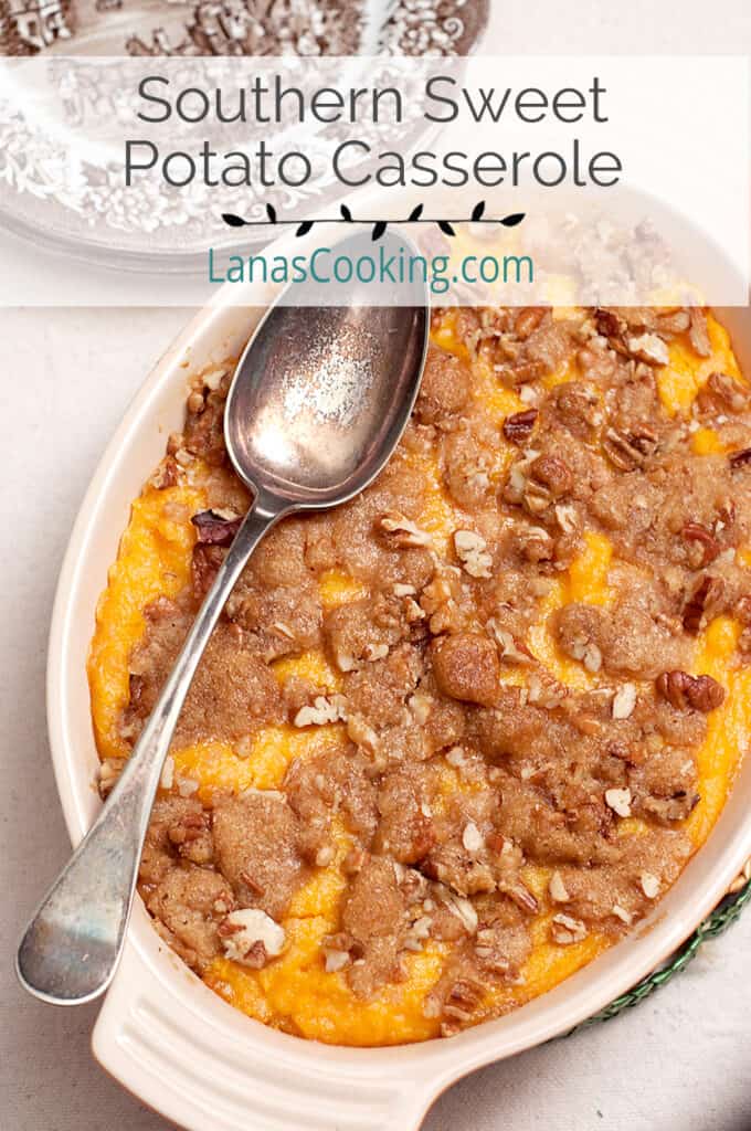 Sweet potato casserole in a baking dish with a vintage serving spoon.