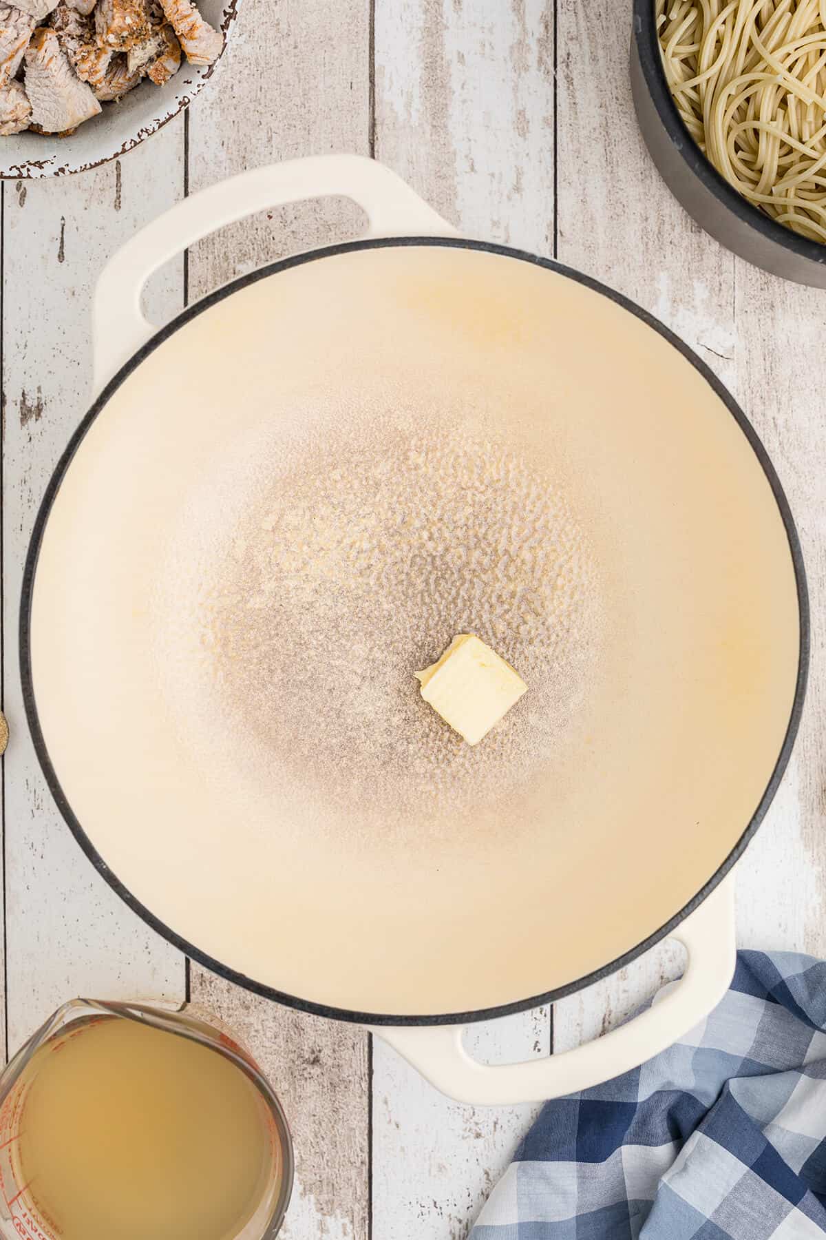 Butter melting in a large saucepan.