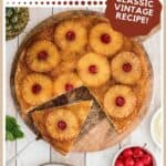 A pineapple upside down cake with cherries, one slice served on a plate with whipped cream and cherries.