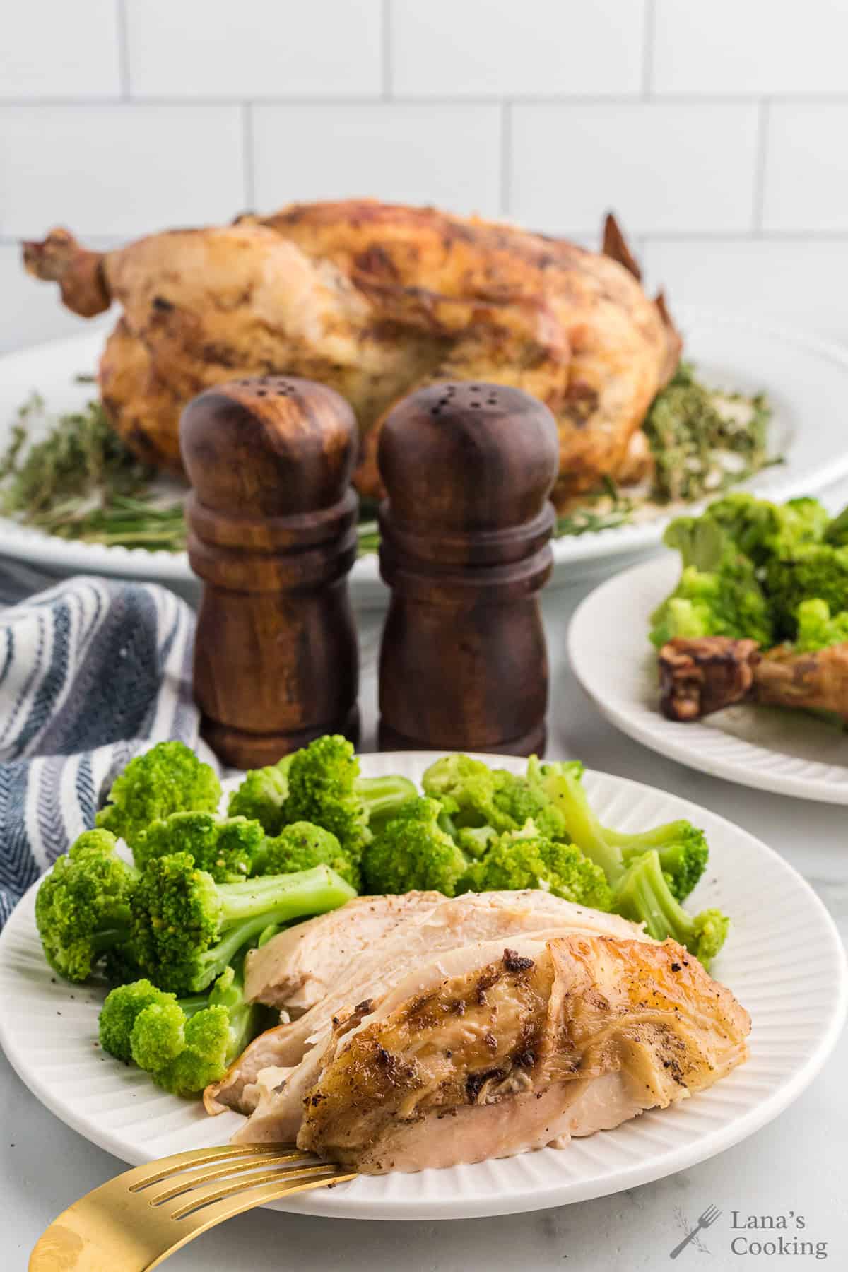 Chicken and broccoli on a dinner. plate.