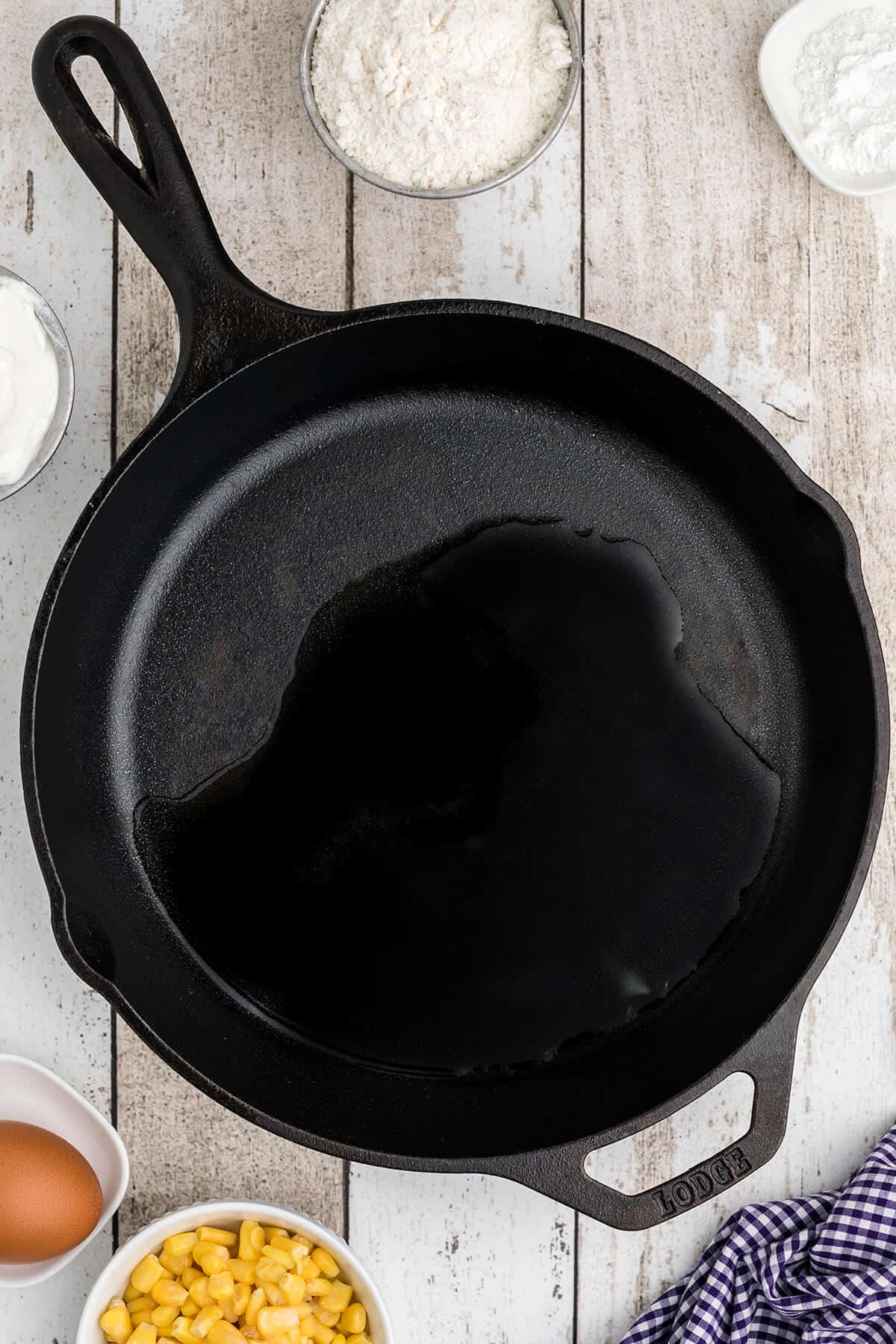 Cast iron skillet with oil in the bottom.
