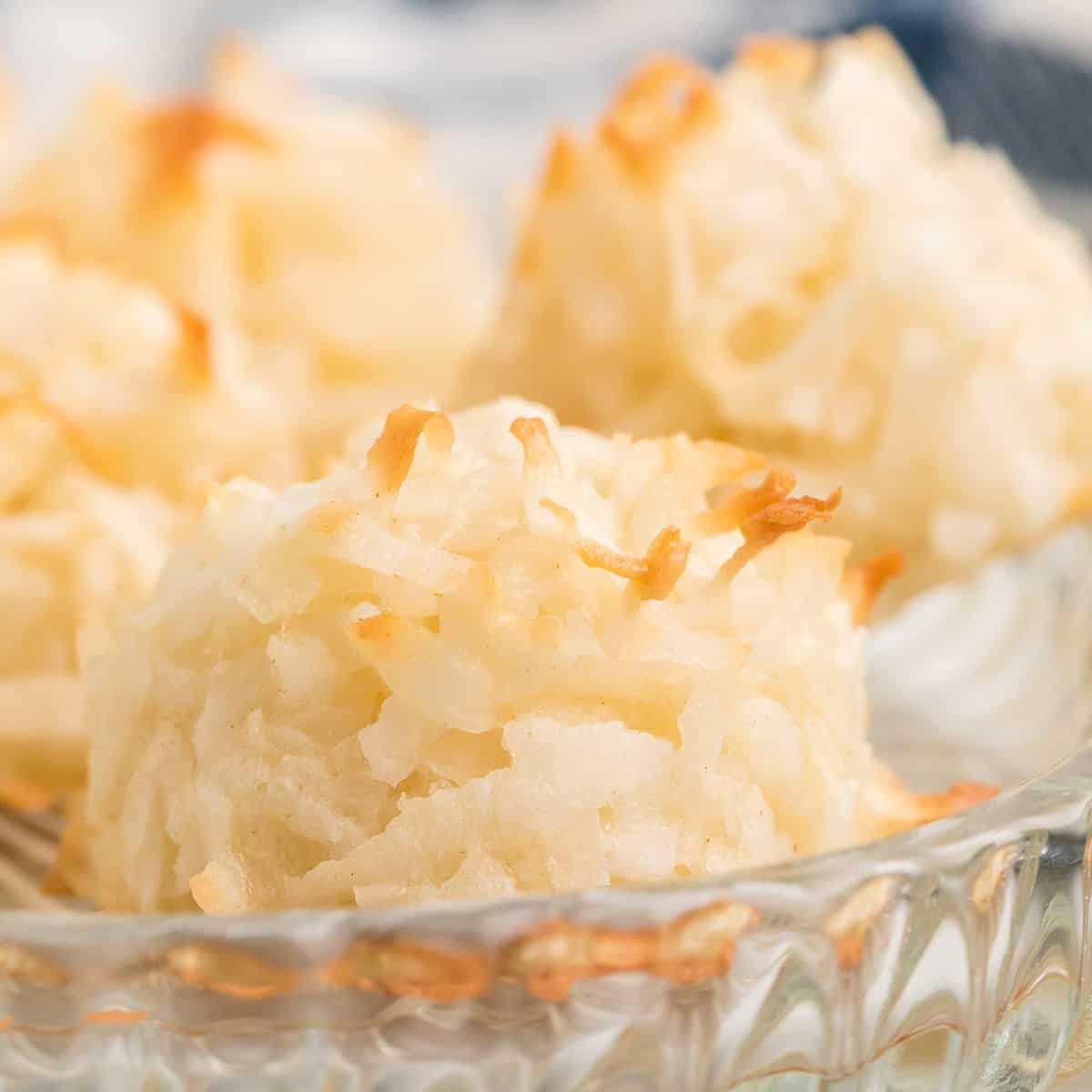 Macaroons in a glass serving dish.