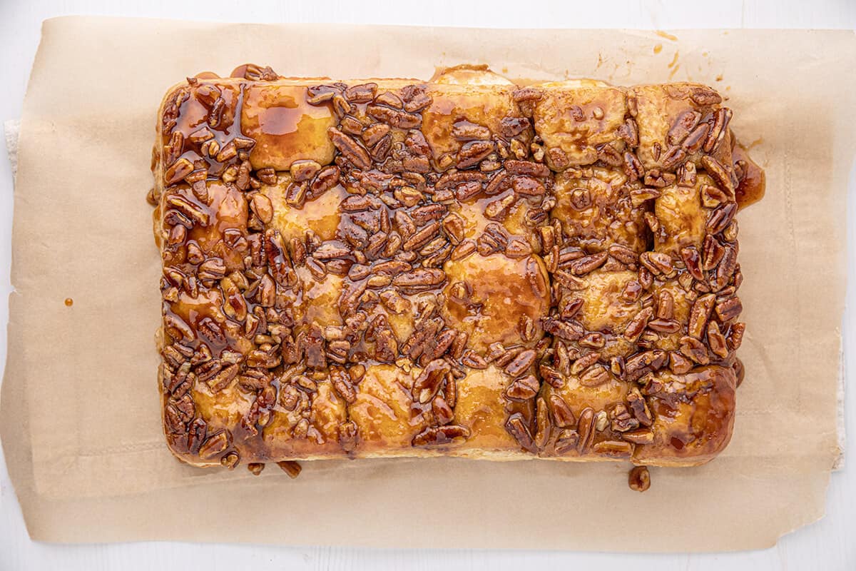 Sticky buns turned out onto parchment paper.