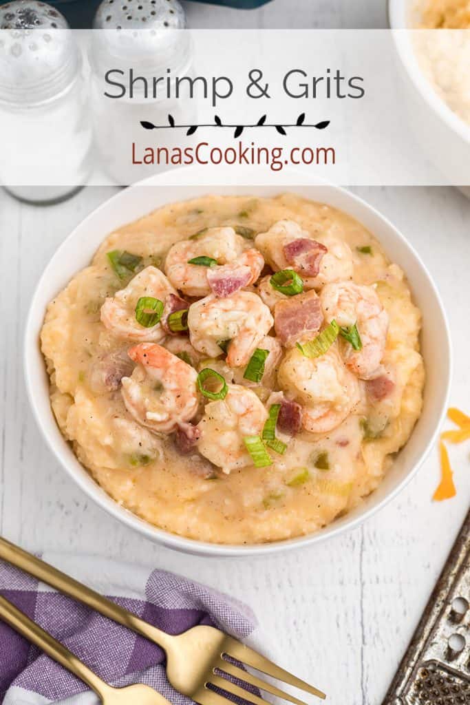 A serving a shrimp and grits in a white bowl.