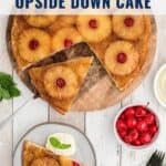 A pineapple upside-down cake with cherries, served with ice cream and fresh cherries on the side.