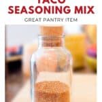 A glass jar filled with homemade taco seasoning mix, labeled as a great pantry item.