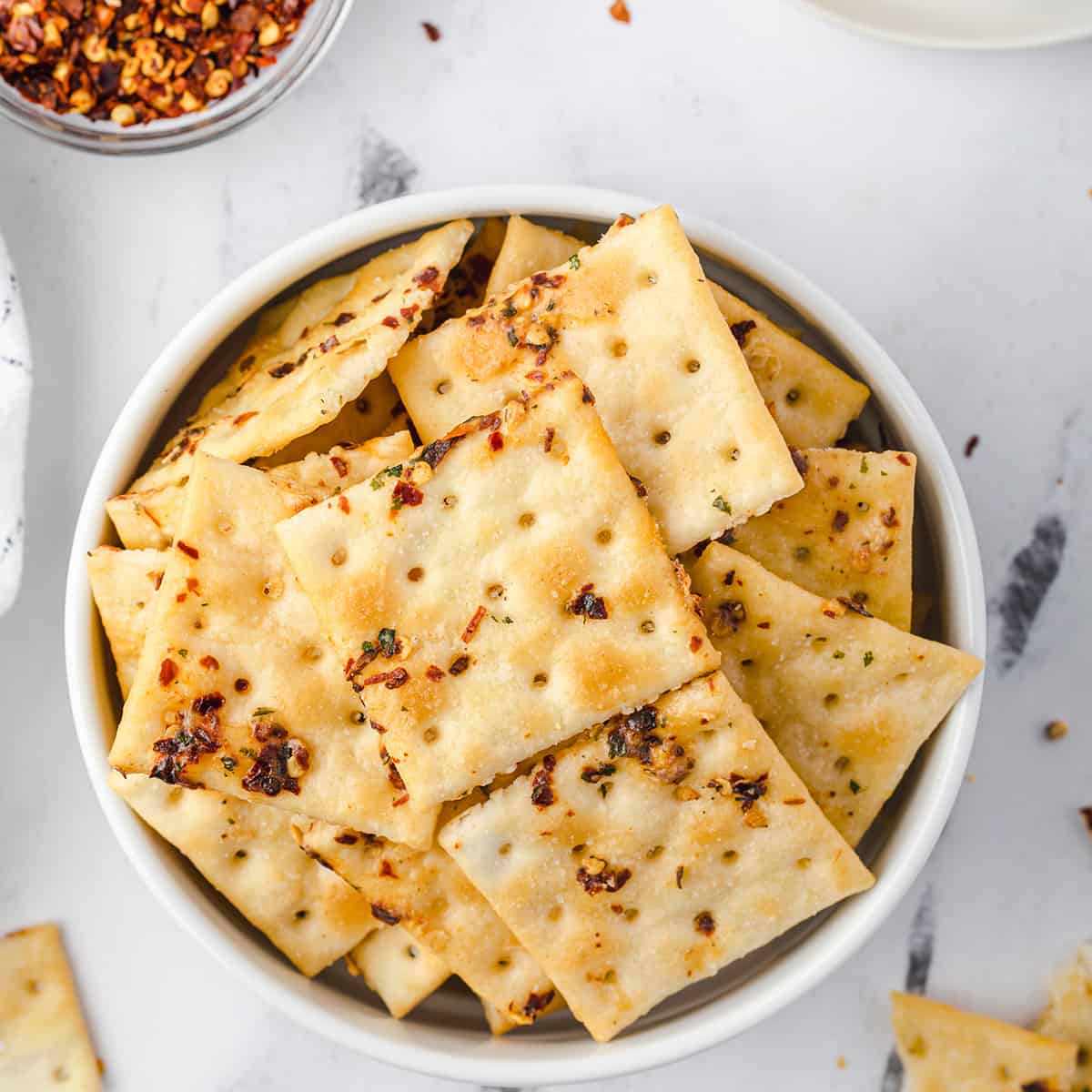 Finished crackers in a white serving bowl.