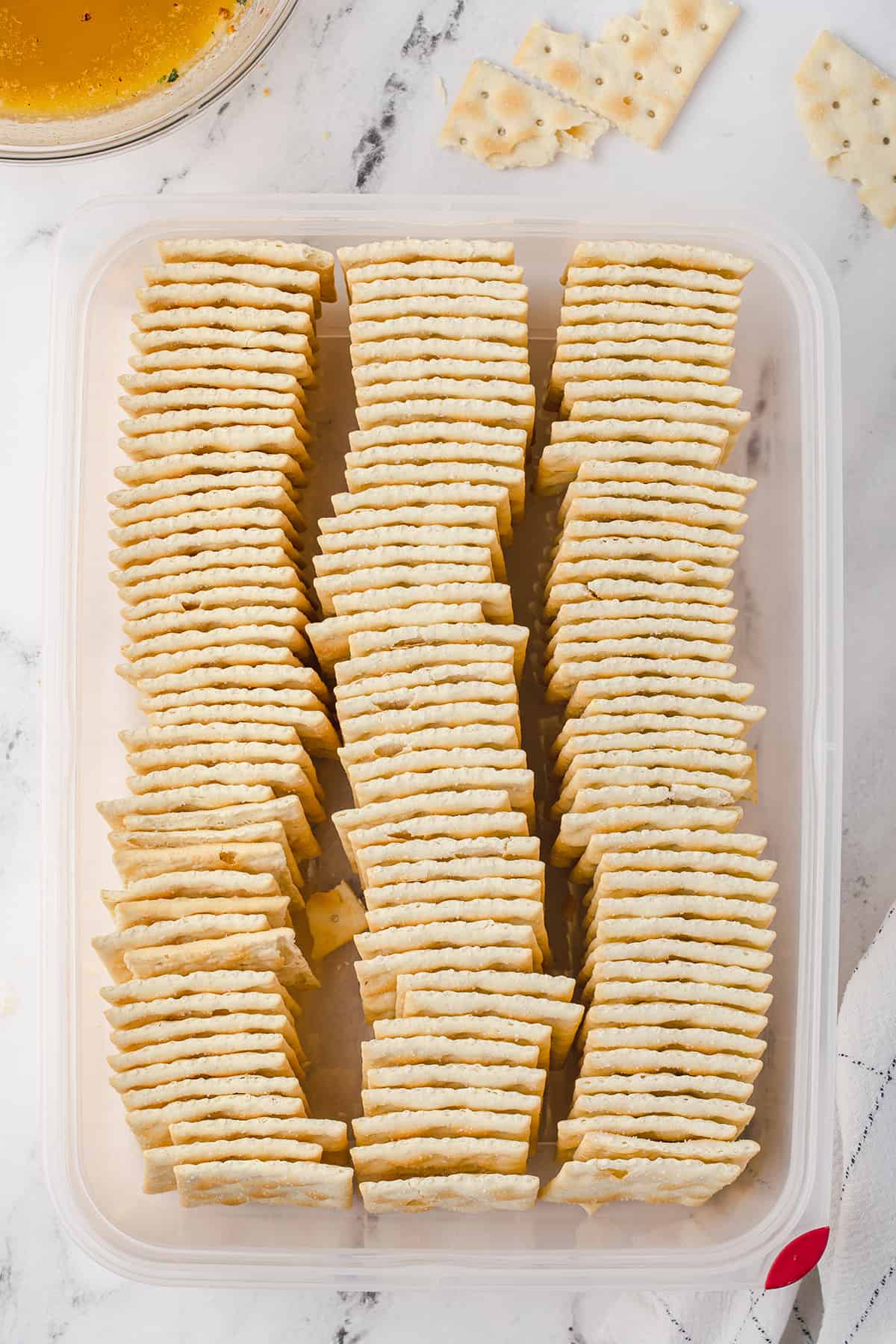 Crackers lined in a plastic container.