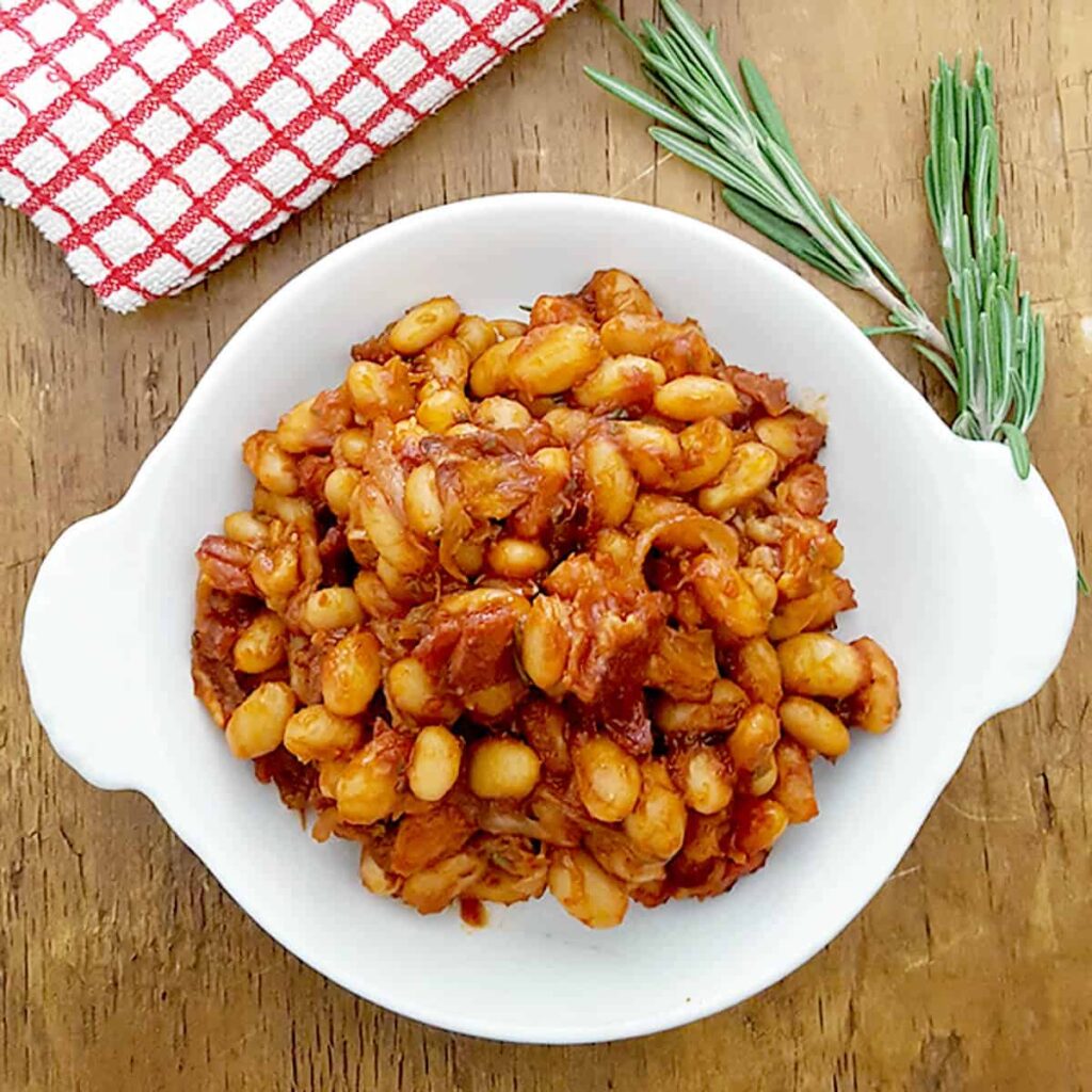 Finished BBQ Beans in a white serving bowl.